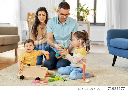 happy family palying with wooden toys at home happy family palying with wooden toys at home 71925677