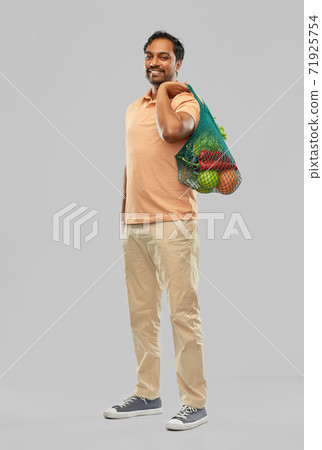 happy indian man with food in reusable net tote happy indian man with food in reusable net tote 71925754