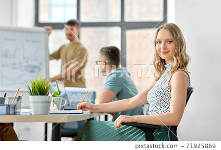 smiling businesswoman at office conference smiling businesswoman at office conference 71925869