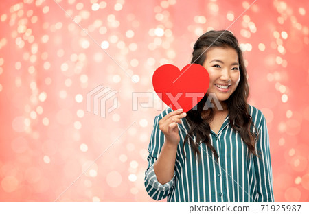 happy asian woman with red heart happy asian woman with red heart 71925987