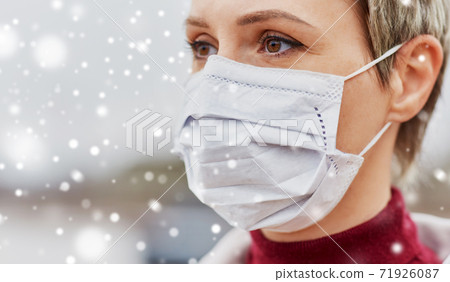 young woman wearing protective medical mask young woman wearing protective medical mask 71926087