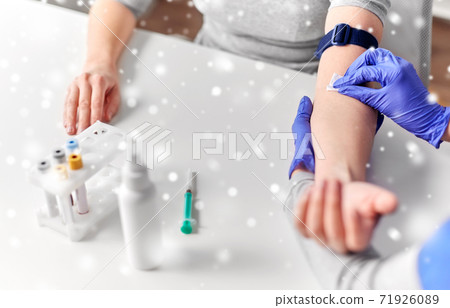 doctor and patient preparing for blood test doctor and patient preparing for blood test 71926089