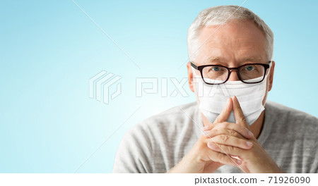 close up of senior man in glasses and medical mask close up of senior man in glasses and medical mask 71926090