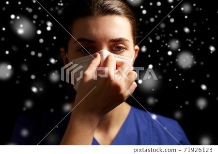 female doctor or nurse in medical face mask female doctor or nurse in medical face mask 71926123