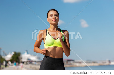 young woman running at seaside young woman running at seaside 71926283