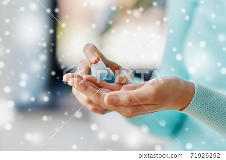 close up of woman spraying hand sanitizer close up of woman spraying hand sanitizer 71926292