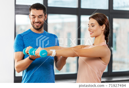happy couple exercising at home happy couple exercising at home 71927494