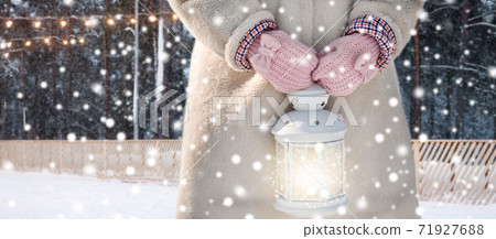 close up of girl with magical christmas lantern 71927688