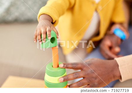 close up of baby playing toy blocks at home close up of baby playing toy blocks at home 71927719