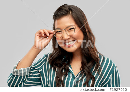 portrait of happy asian woman in glasses portrait of happy asian woman in glasses 71927930