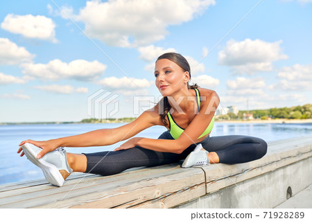 young woman doing sports outdoors young woman doing sports outdoors 71928289