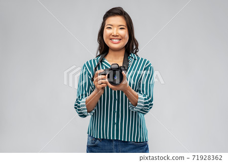 asian female photographer with digital camera asian female photographer with digital camera 71928362