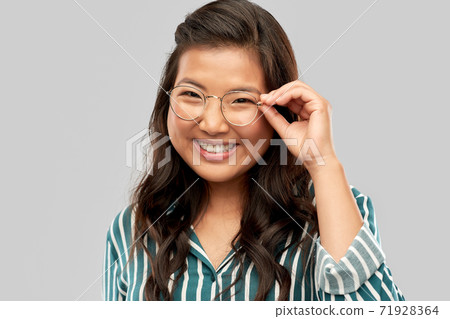 portrait of happy asian woman in glasses portrait of happy asian woman in glasses 71928364