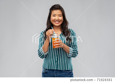 asian woman with juice in plastic cup with straw asian woman with juice in plastic cup with straw 71928381