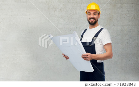 male worker or builder in helmet with blueprint male worker or builder in helmet with blueprint 71928848
