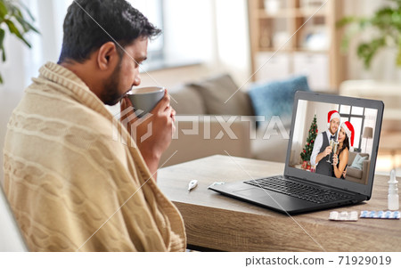 sick man having video call with friends at home sick man having video call with friends at home 71929019