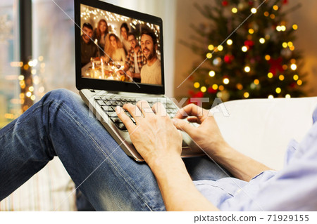 man having video call with friends on christmas 71929155