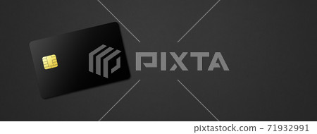 Black credit card on a dark background 71932991