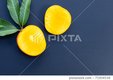 Tropical fruit, Mango on dark background. Tropical fruit, Mango on dark background. 71934530