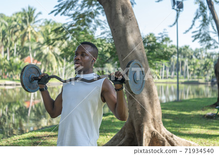 African American man exercising in the park African American man exercising in the park 71934540