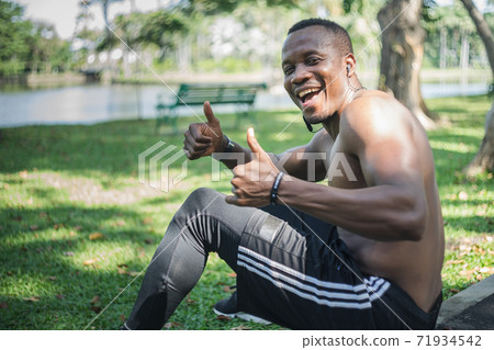 African American man exercising in the park African American man exercising in the park 71934542