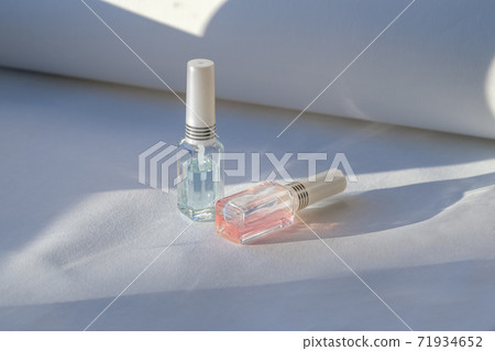 Bottles of transparent nail polishes 71934652