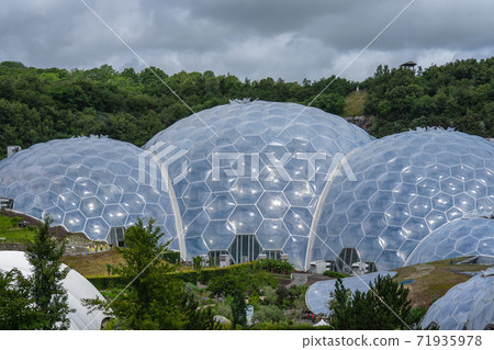 The Eden Project is a visitor attraction in Cornwall, England, UK. Inside the two biomes are plants that are collected from many diverse climates and environments 71935978