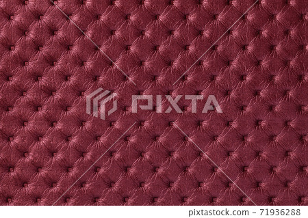 Texture of dark red leather background with capitone pattern, macro. Texture of dark red leather background with capitone pattern, macro. 71936288