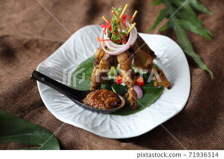 Chicken Satay on dark brown table street food appetizer 71936314