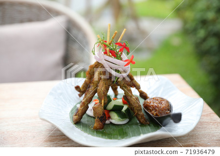 Chicken Satay on dark brown table street food appetizer 71936479