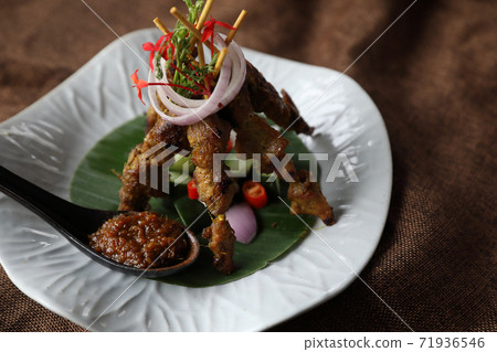 Chicken Satay on dark brown table street food appetizer Chicken Satay on dark brown table street food appetizer 71936546