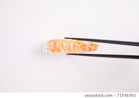 Shrimp sushi with chopsticks Japanese food isolated in white background Shrimp sushi with chopsticks Japanese food isolated in white background 71936763