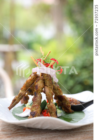 Chicken Satay on dark brown table street food appetizer 71937235