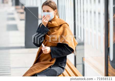 Woman with face mask during epidemic outdoors Woman with face mask during epidemic outdoors 71938511