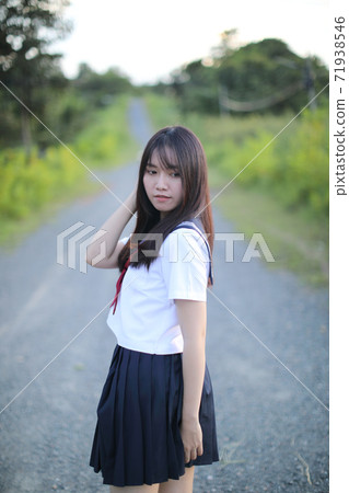 Portrait of asian japanese school girl costume looking at park outdoor 71938546