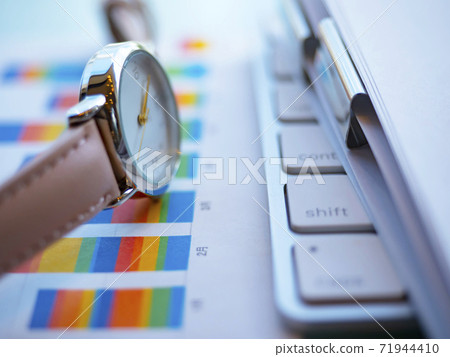 Business image, graph, documents, keyboard, clock, woman Business image, graph, documents, keyboard, clock, woman 71944410