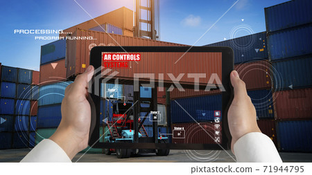 Engineer use augmented reality software in cargo container yard 71944795