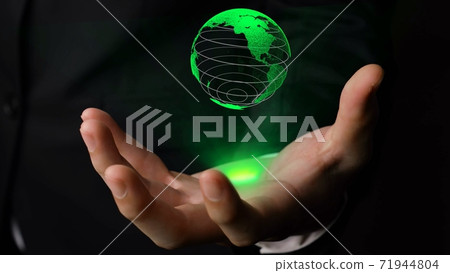 Human hand holding earth globe holographic technology 71944804