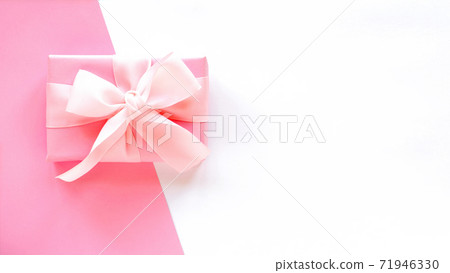 A gift box on two-color background 71946330
