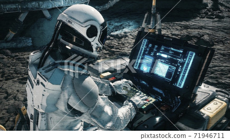 An astronaut works on his laptop at a space base on one of the new planets. 3D Rendering. 71946711
