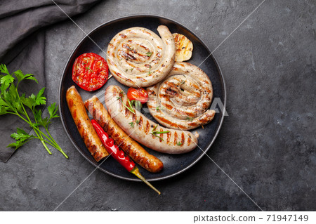 Hot spicy grilled sausages 71947149