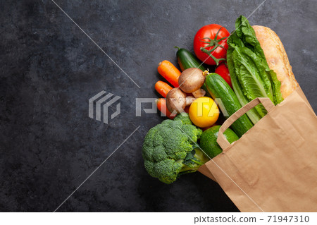 Different food in recycling paper bag 71947310