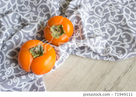Fresh ripe persimmon, persimmon. Vitamins in the winter 71949111