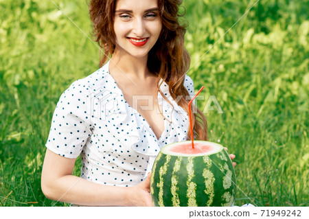 Watermelon with cocktail straw. 71949242