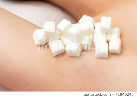 Sugar cubes on armpit. Sugar cubes on armpit. 71949245