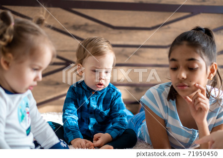 friendship, childhood, technology concepts - 3 young children baby of different nationalities Persian and Slavic appearance watch cartoon on smartphone on bed. kids preschool speak by video conference friendship, childhood, technology concepts - 3 young children baby of different nationalities Persian and Slavic appearance watch cartoon on smartphone on bed. kids preschool speak by video conference 71950450