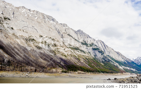 Steep mountain side and river. Steep mountain side and river. 71951525