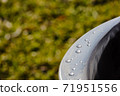 Detail of water droplets on smooth metal surface. 71951556