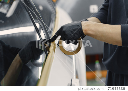 Preparing a car before spray painting Preparing a car before spray painting 71953886