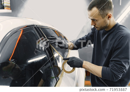 Preparing a car before spray painting Preparing a car before spray painting 71953887
